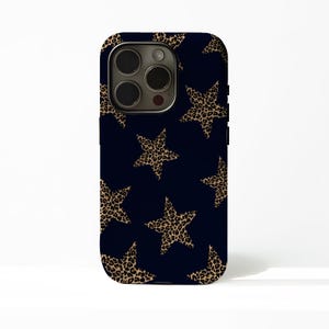 May include: A navy blue phone case featuring a repeating pattern of leopard print stars. The case has a glossy finish and a camera cutout. The design is a mix of animal print and celestial themes.