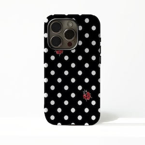 May include: Black phone case with a white polka dot pattern and two red ladybug illustrations. The case has a glossy finish and a camera cutout at the top.