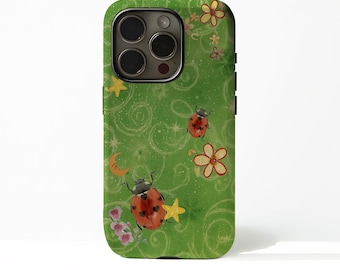 May include: Green phone case featuring a whimsical design with ladybugs, flowers, stars, and a crescent moon. The case has a glossy finish and a protective design. The ladybugs are red with black spots, and the flowers are pink and yellow.