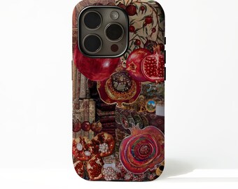 May include: A smartphone case featuring a collage of pomegranate imagery. The design includes whole and sliced red pomegranates, intricate patterns, and textured elements in shades of deep red, brown, and gold, covering the entire back surface.