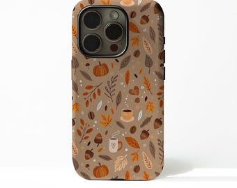 May include: A phone case with a fall-themed pattern. The design features pumpkins, leaves, coffee cups, acorns, and coffee beans in shades of brown, orange, and beige. The case has a camera cutout and side buttons.