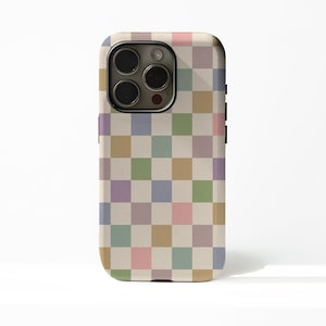 May include: A phone case with a pastel checkerboard pattern. The case features a grid of squares in various colors, including pink, green, purple, and tan. The phone case has a camera and button cutouts.
