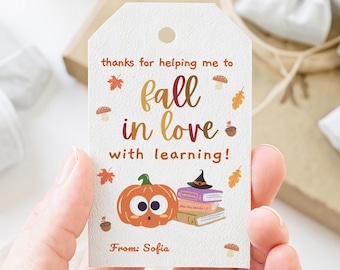 May include: A white gift tag with the text "thanks for helping me to fall in love with learning!" and "From: Sofia". The tag features a pumpkin, books, and fall-themed illustrations.