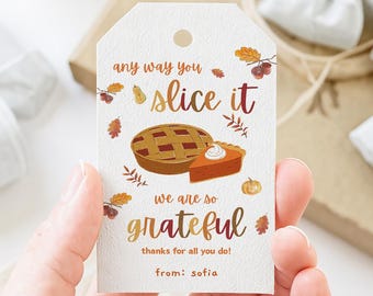 May include: A white gift tag with the text "any way you slice it, we are so grateful" and a pie illustration. The tag also includes the text "thanks for all you do!" and "from: sofia".