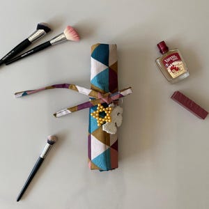 makeup brush holder,handmade brush organizer,customizable makeup storage,cosmetic organizer,fabric brush holder,portable makeup storage