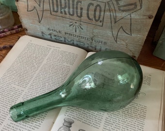 A Souvenir From Probably A Horrible Wine Antique Green Blown Round Ended Glass Bottle