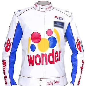 May include: White jacket with blue and red accents, featuring the word "Wonder" in large red letters. The jacket has a stand-up collar and the name "Ricky Bobby" on the bottom. Flames and the word "Wonder" are printed on the sleeves.