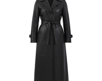 May include: A long, black leather trench coat with a belted waist and button closures. The coat features a classic lapel collar and long sleeves with buttoned cuffs. The coat is designed to be worn over other clothing.