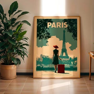 May include: A framed travel poster with the word "PARIS" at the top. The poster depicts a woman in a dress and red hat, pulling a red suitcase, with the Eiffel Tower in the background. The poster has a vintage travel theme.