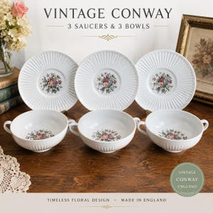 May include: A set of three white ceramic saucers and three matching two-handled bowls, each featuring a central colourful floral bouquet and a ribbed texture. The text VINTAGE CONWAY 3 SAUCERS & 3 BOWLS is displayed above the items in the image.