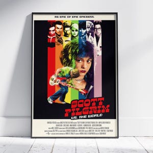 May include: A framed movie poster for "Scott Pilgrim vs. The World." The poster features a collage of characters with a central image of a woman with colorful hair. The title is in red, and the background is black.