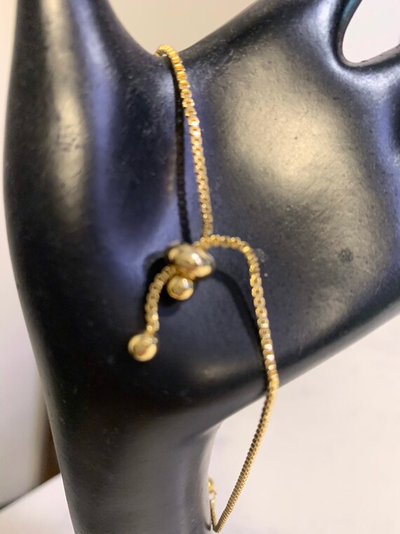 Gold tone expandable Star of David bracelet
