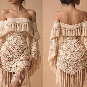 May include: Off-the-shoulder crochet dress in a cream color. The dress features long sleeves, a fitted bodice, and a fringed hemline. The crochet design includes floral patterns and fringe detailing around the neckline and sleeves.