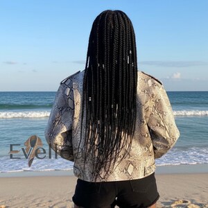 May include: A white ceramic mug with a black handle and the text "But First, Coffee" in a black, bold font. The mug is on a white surface. The mug is approximately 4 inches tall.