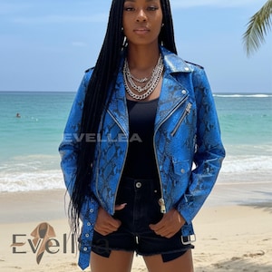 May include: A blue snakeskin-effect leather jacket with a silver zip and multiple pockets. The jacket has a classic biker style with a notched collar and asymmetrical zip closure. The brand name "Evellea" is visible on the jacket.