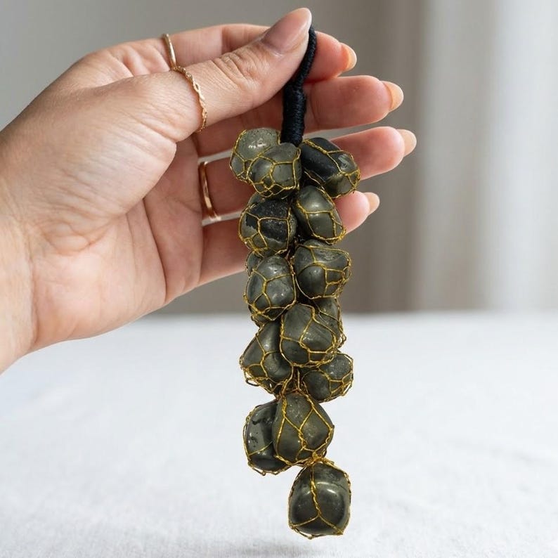 Pyrite grape bunch decoration symbolizing wealth and prosperity