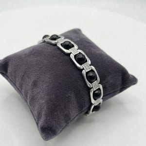 Spiritual karungali protection bracelet crafted from authentic ebony wood beads for grounding and energy balance.