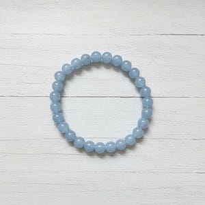 Handmade light blue aquamarine beaded bracelet for healing and balance.