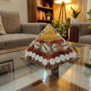 EMF protection pyramid crafted from copper, shells and resin.