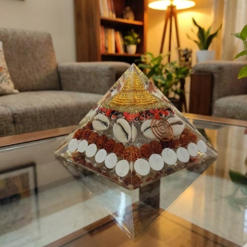 EMF protection pyramid crafted from copper, shells and resin.