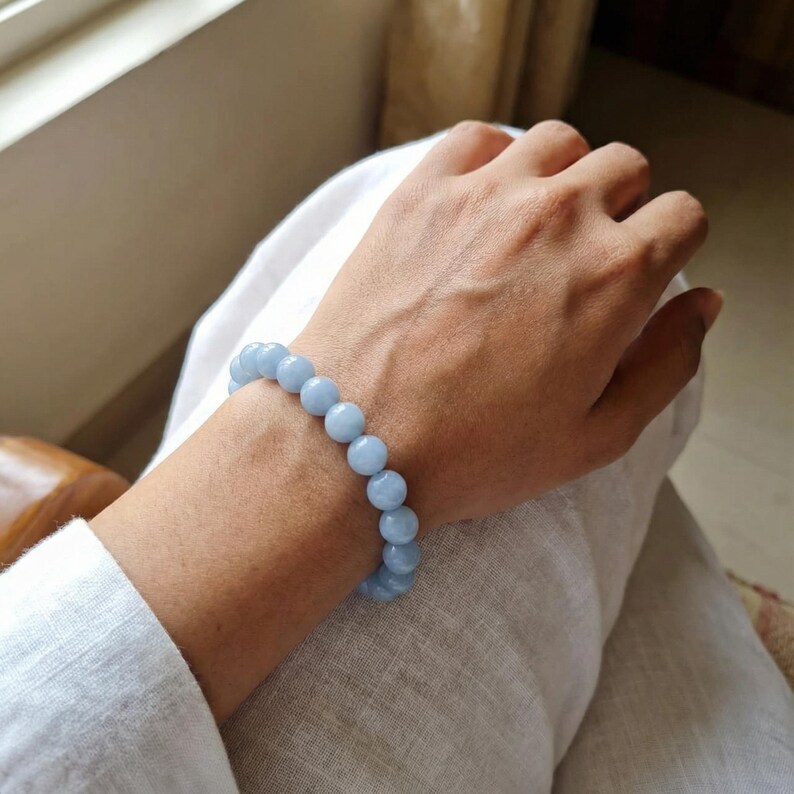Stretch aquamarine bracelet promoting clarity and inner peace.