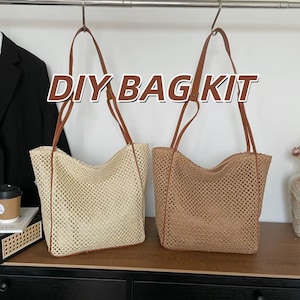 May include: Two open-weave tote bags with brown leather straps hang from a metal bar. One bag is beige, the other is brown. The text "DIY BAG KIT" is displayed across the top of the image.