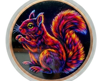 May include: A circular coin featuring a vibrant, multi-colored illustration of a squirrel against a solid black background. The squirrel is rendered in bright shades of red, orange, yellow, and purple, enclosed within a metallic copper-toned rim.