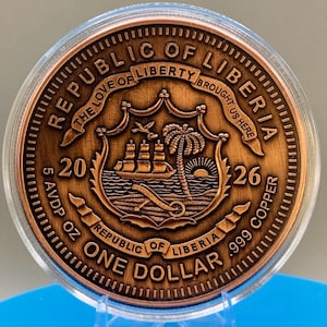 Reverse side of the 5 oz colorized copper legal tender coin, marked "Republic of Liberia," "One Dollar," and a ship design