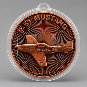 Front of a 1 oz .999 fine copper round featuring an embossed P-51 Mustang WWII fighter aircraft in flight, housed in a clear protective capsule, on a gray background.