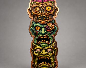 May include: A vertical metal pin featuring a stack of three stylized zombie heads. The top head is tan with an exposed pink brain, the middle head is green with an eye patch, and the bottom head is yellow-green, all with open mouths and teeth.
