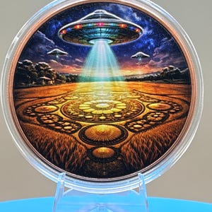 5 oz .999 fine copper round featuring a colorful UFO hovering over an intricate crop circle with glowing tractor beam artwork.