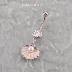 May include: A set of three ceramic mugs with a speckled, matte finish. The mugs are in shades of cream, light gray, and dark gray. Each mug has a simple, minimalist design and a rounded handle. The mugs are suitable for coffee, tea, or other beverages.