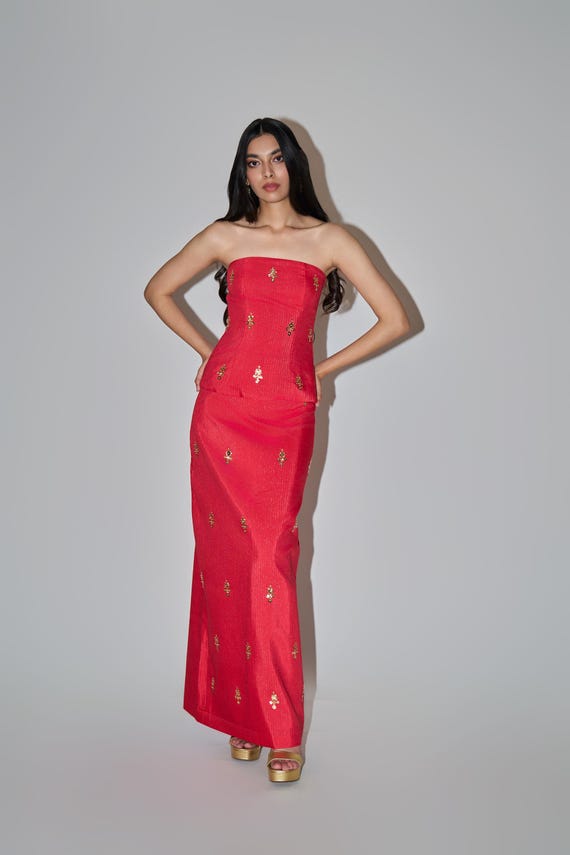 corset indo western dress For the bride rewriting elegance in her own wordsmeet our Corset Dhoti Skirt and Cropped Cape Set, a salmon-hued dream from Rendezvous Trousseau 2025. This isn't just a dress; it's your