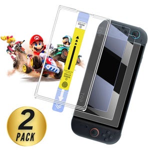 May include: A screen protector set for a gaming console. The image shows a black console with a screen protector overlay, a yellow application guide, and a gold circle with the text "2 PACK". A graphic of Mario Kart characters is in the background.