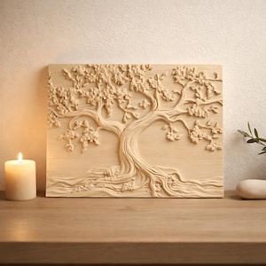 May include: A light-coloured wooden wall art piece featuring a detailed relief carving of a tree with leaves and branches. The tree's trunk and roots are intricately carved. A lit candle sits to the left of the artwork.