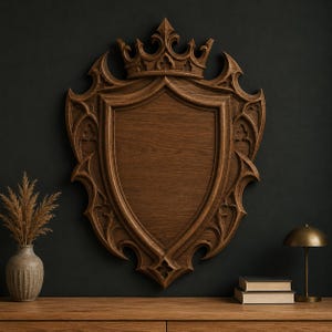 May include: A large, intricately carved wooden shield with a crown at the top. The shield is a rich brown color and features detailed gothic-style embellishments. It is mounted on a dark wall, suggesting a decorative or historical theme.
