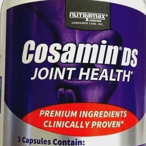 May include: A white bottle of Cosamin DS Joint Health dietary supplement. The label is purple and red with white text, including "Premium Ingredients Clinically Proven." Contains 210 capsules.