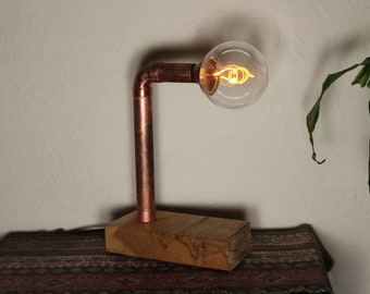 Recycled copper pipe lamp with vintage style light bulb