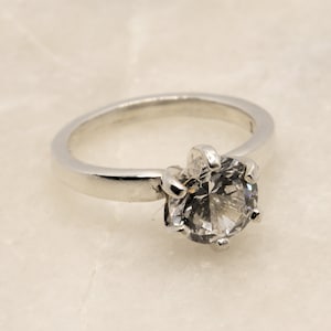 White sapphire sterling ring.