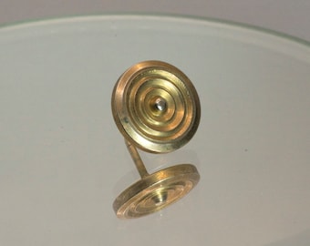 Brass shield tie tack.