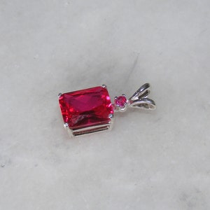 Ruby pendant with ruby accent mounted in silver.9x7 image 3