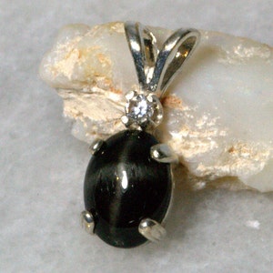 Black Star Diopside Accented Pendant.