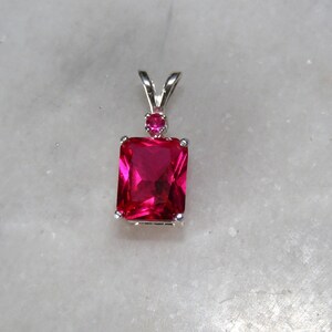 Ruby pendant with ruby accent mounted in silver.9x7 image 2