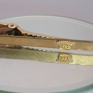 Gold filled crown tie bar.