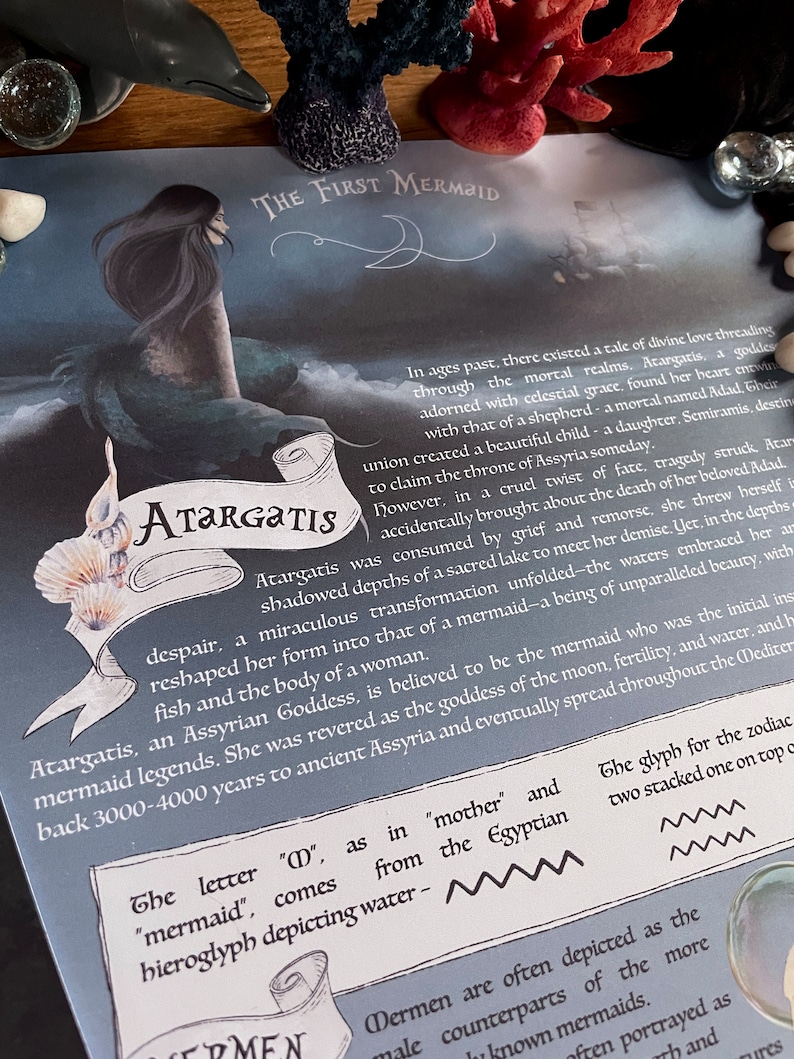 May include: A close-up of a text-based image with a blue and white illustration of a mermaid. The text reads "The First Mermaid" and "Atargatis". The text also describes the mermaid as the "Assyrian Goddess" and the "initial inspiration for mermaid legends".