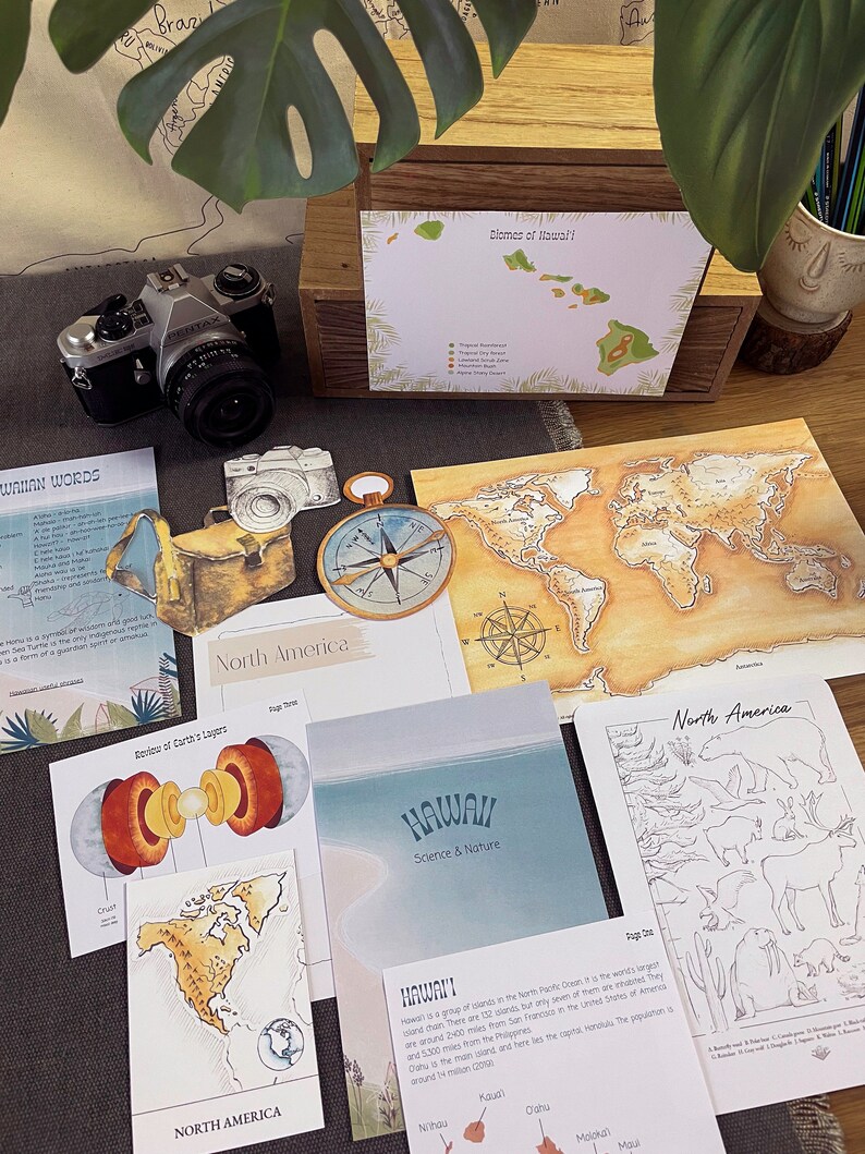 May include: A set of educational flashcards featuring illustrations of North America, Hawaii, and the Earth's layers. The cards include a world map, a map of Hawaii with its islands, and a diagram of the Earth's crust, mantle, outer core, and inner core. The cards are printed on white cardstock with colorful illustrations and text.