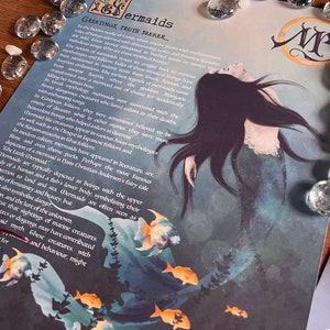 May include: A blue and green illustration of a mermaid with long black hair and a tail. The mermaid is surrounded by a school of orange fish. The text "Mermaids Greetings, Truth Seeker..." is at the top of the image.