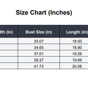 May include: A size chart in a table format, with measurements in inches. The chart includes sizes S, M, L, XL, and XXL, with corresponding bust, length, and sleeve length measurements. The text "Size Chart (Inches)" is at the top.