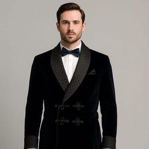 May include: A black velvet robe with a quilted shawl collar and cuffs. The robe features a double-breasted design with four decorative frog closures. A black bow tie is worn with a white dress shirt.