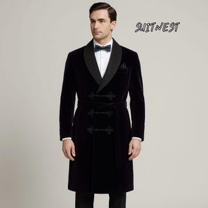 May include: A dark navy velvet robe with a quilted lapel and a matching belt. The robe has a double-breasted closure with decorative buttons and a small pocket. The text "SUITNEST" is visible in the upper right corner.